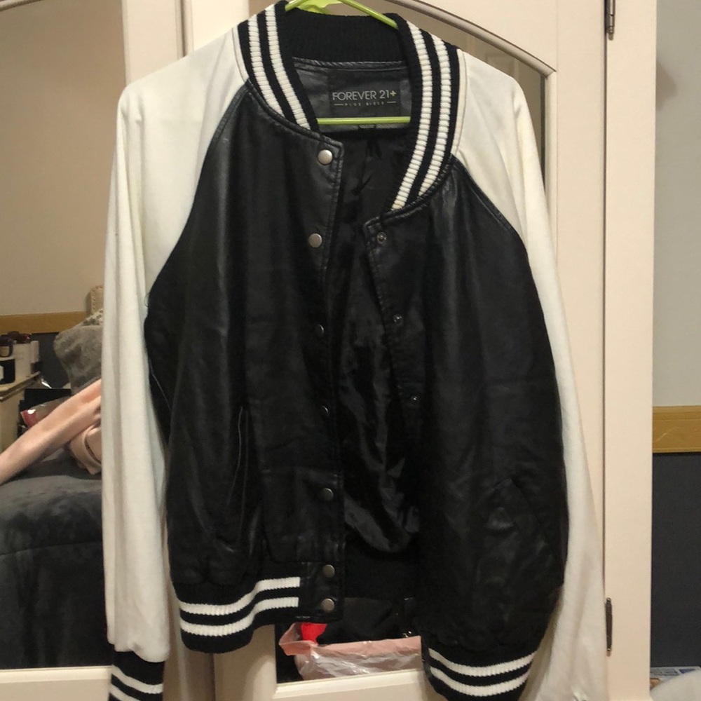 Faux leather jacket with white sleeves